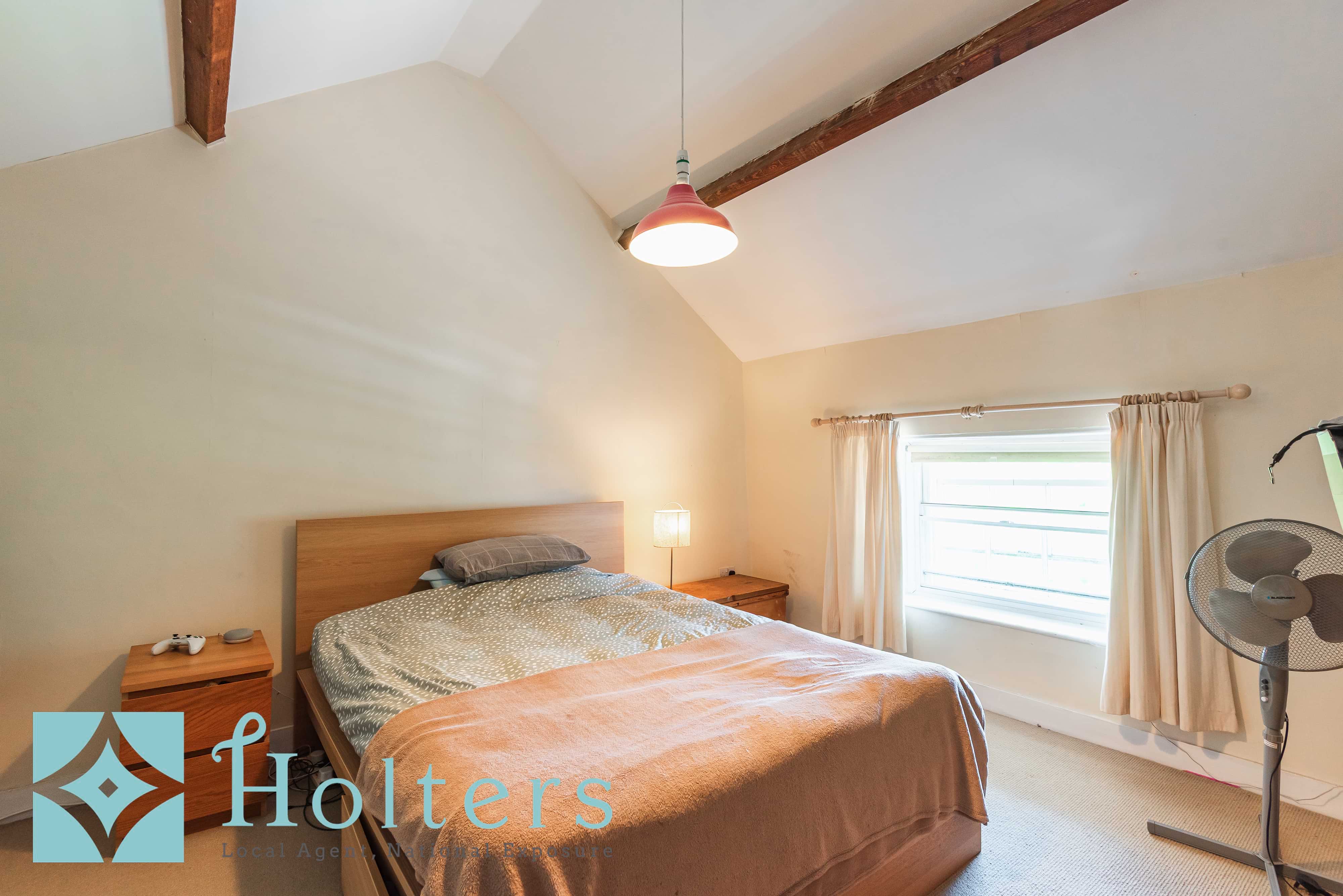 Attic room with exposed beams